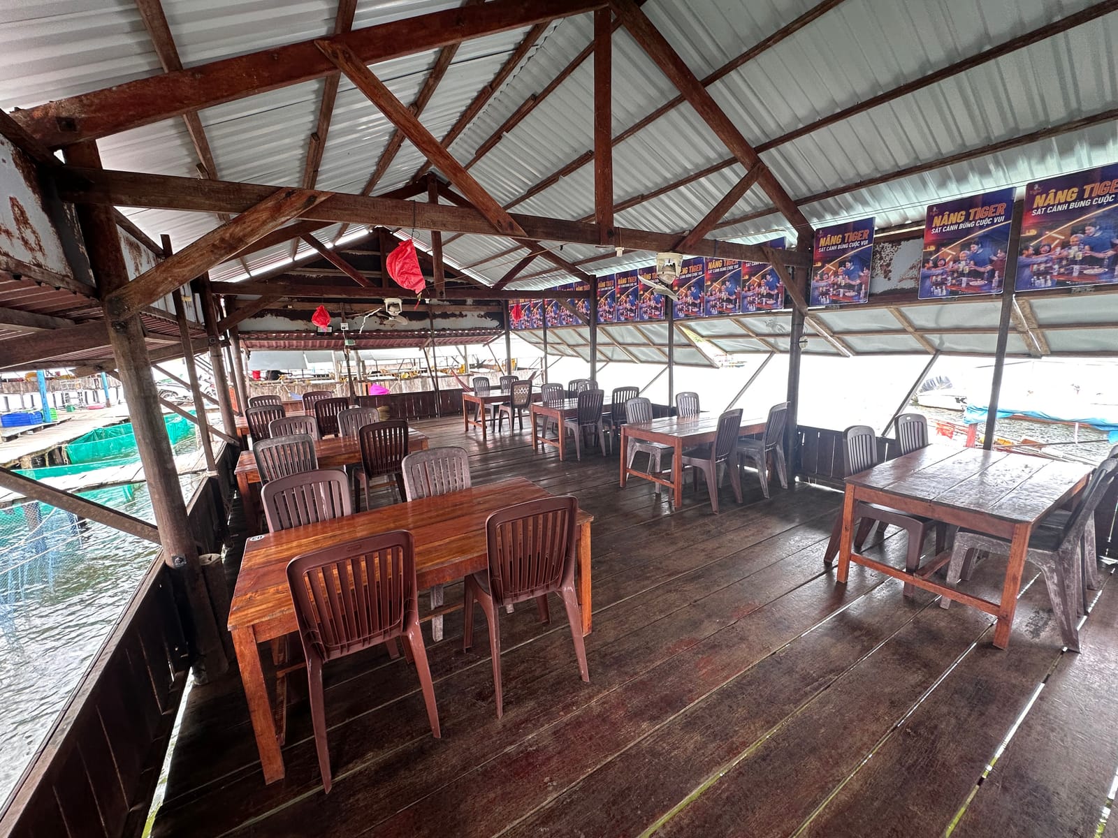 Long wooden tables in the dining hall, joined into rows for groups